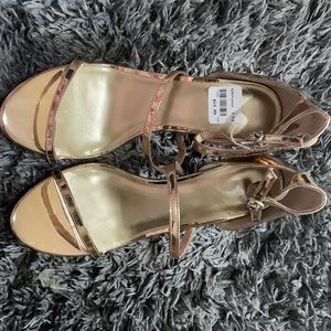 Brand new Fioni bronze heel shoes.